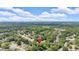 Aerial view of the property showcasing its location within a neighborhood surrounded by green trees and a blue sky at 5705 Cannonero Dr Dr, Alpharetta, GA 30005