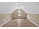 Unfinished attic featuring ceiling fan and natural light at 5705 Cannonero Dr Dr, Alpharetta, GA 30005