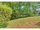 This home features a sprawling backyard with lush greenery offering plenty of space for outdoor activities at 5705 Cannonero Dr Dr, Alpharetta, GA 30005