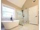 Modern bathroom features a sleek soaking tub and frameless glass shower at 5705 Cannonero Dr Dr, Alpharetta, GA 30005