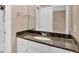 Bathroom with a granite countertop, white cabinetry, and a shower head at 5705 Cannonero Dr Dr, Alpharetta, GA 30005