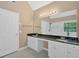 Bright bathroom features a double vanity with dark counters, sleek fixtures, and a spacious walk-in shower at 5705 Cannonero Dr Dr, Alpharetta, GA 30005