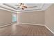 Spacious bedroom features hardwood floors, tray ceilings, and natural light at 5705 Cannonero Dr Dr, Alpharetta, GA 30005