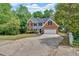 Charming two-story home with brick accents, two car garage, and landscaped front yard at 5705 Cannonero Dr Dr, Alpharetta, GA 30005