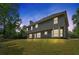 Backyard view of a two story house at dusk at 5705 Cannonero Dr Dr, Alpharetta, GA 30005