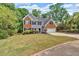 Charming two-story home with brick and gray siding, well-manicured lawn, and attached two-car garage at 5705 Cannonero Dr Dr, Alpharetta, GA 30005