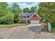 Lovely two-story home with a well-maintained lawn, mature trees, and an attached two-car garage at 5705 Cannonero Dr Dr, Alpharetta, GA 30005