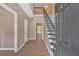 Inviting foyer with wood floors, a wrought iron staircase, and neutral paint that complements natural light at 5705 Cannonero Dr Dr, Alpharetta, GA 30005