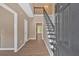 Inviting foyer features hardwood floors, staircase, and views into other rooms at 5705 Cannonero Dr Dr, Alpharetta, GA 30005