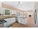 Open concept kitchen with stainless appliances, granite counters, white cabinets, and an island with seating at 5705 Cannonero Dr Dr, Alpharetta, GA 30005