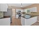 Kitchen featuring white cabinets, granite countertops, and stainless steel appliances at 5705 Cannonero Dr Dr, Alpharetta, GA 30005