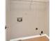 This clean laundry room is efficiently designed with utility connections at 5705 Cannonero Dr Dr, Alpharetta, GA 30005