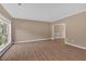 This bright living room features new flooring and a large window for natural light at 5705 Cannonero Dr Dr, Alpharetta, GA 30005