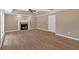 Bright living room with laminate flooring, fireplace, and tray ceiling; the design offers comfort and style at 5705 Cannonero Dr Dr, Alpharetta, GA 30005