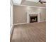 Open-concept living room with fireplace and lots of natural light at 5705 Cannonero Dr Dr, Alpharetta, GA 30005