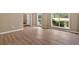 Bright living room featuring laminate flooring and large windows, creating an open and welcoming space at 5705 Cannonero Dr Dr, Alpharetta, GA 30005