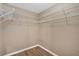 Empty walk-in closet with multiple shelves and hardwood floors at 5705 Cannonero Dr Dr, Alpharetta, GA 30005