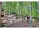 Backyard boasts terraced landscaping, stone steps, and a quaint storage shed at 2689 Cosmos Ne Dr, Atlanta, GA 30345