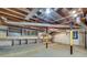 Spacious unfinished basement with exposed beams, lighting, and storage shelves at 2689 Cosmos Ne Dr, Atlanta, GA 30345