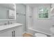 Modern bathroom featuring a sleek vanity, integrated lighting, and a shower-tub combination at 2689 Cosmos Ne Dr, Atlanta, GA 30345