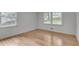 Bright bedroom with gleaming hardwood floors and double-hung windows at 2689 Cosmos Ne Dr, Atlanta, GA 30345