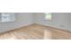 Bright bedroom with hardwood floors and natural light from two windows at 2689 Cosmos Ne Dr, Atlanta, GA 30345