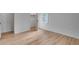 Bright bedroom with hardwood floors, a window, closet, and white walls at 2689 Cosmos Ne Dr, Atlanta, GA 30345