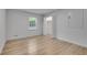 Bright bedroom with hardwood floors, a window, and a closet at 2689 Cosmos Ne Dr, Atlanta, GA 30345