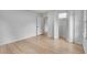 Bright bedroom with hardwood floors, a closet, and multiple doors at 2689 Cosmos Ne Dr, Atlanta, GA 30345