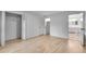 Bright bedroom showing hardwood floors, a closet, and a view of an ensuite bathroom at 2689 Cosmos Ne Dr, Atlanta, GA 30345
