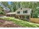Classic home with a brick and siding exterior, lush lawn, and a convenient covered parking area at 2689 Cosmos Ne Dr, Atlanta, GA 30345
