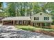 Charming home featuring a carport, well-maintained lawn, and classic brick and siding facade at 2689 Cosmos Ne Dr, Atlanta, GA 30345