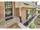 Inviting front entrance with a classic black door, brickwork, and manicured landscaping at 2689 Cosmos Ne Dr, Atlanta, GA 30345
