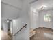 Hallway features a staircase, tile floors, and an entry door providing access to the exterior at 2689 Cosmos Ne Dr, Atlanta, GA 30345