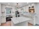 Modern kitchen with white cabinets, granite countertops, and stainless steel appliances at 2689 Cosmos Ne Dr, Atlanta, GA 30345