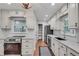 Bright kitchen boasts granite countertops, stainless steel appliances, white subway tile backsplash, and modern light fixture at 2689 Cosmos Ne Dr, Atlanta, GA 30345