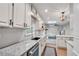 Bright kitchen features granite countertops, stainless steel appliances, and a view into the adjoining living space at 2689 Cosmos Ne Dr, Atlanta, GA 30345