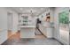 Bright kitchen boasts granite counters, stainless appliances, and island, with easy access to an outdoor deck at 2689 Cosmos Ne Dr, Atlanta, GA 30345