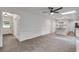 Open-concept living room connects to the kitchen, and features modern ceiling fan and ample space at 2689 Cosmos Ne Dr, Atlanta, GA 30345