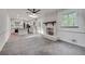 Living room with a fireplace, access to the deck, and connects to the open kitchen at 2689 Cosmos Ne Dr, Atlanta, GA 30345