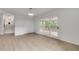 Bright living room area with sliding doors opening to a screened in porch and view of the stairway at 2689 Cosmos Ne Dr, Atlanta, GA 30345