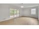 Bright living room area with sliding doors opening to a screened in porch at 2689 Cosmos Ne Dr, Atlanta, GA 30345