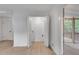 Bright living room area featuring closet doors and sliding doors opening to a screened in porch at 2689 Cosmos Ne Dr, Atlanta, GA 30345