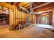 Unfinished basement featuring exposed beams, wood frame, and a concrete floor at 441 Belgrave Ln, Tucker, GA 30084