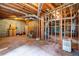 Unfinished basement featuring exposed beams, wood frame, and a concrete floor at 441 Belgrave Ln, Tucker, GA 30084