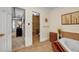 Contemporary bathroom features tiled floor, soaking tub, and separate shower at 441 Belgrave Ln, Tucker, GA 30084