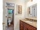 Bathroom featuring tile floor, granite vanity, and a framed mirror at 441 Belgrave Ln, Tucker, GA 30084