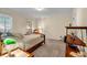 Cozy bedroom featuring natural light, carpeted floors, and a charming vintage chair at 441 Belgrave Ln, Tucker, GA 30084