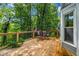 Spacious deck featuring wood flooring, outdoor seating, and a view of the lush backyard at 441 Belgrave Ln, Tucker, GA 30084