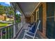 Spacious front porch with white rocking chairs and a charming neighborhood view at 441 Belgrave Ln, Tucker, GA 30084